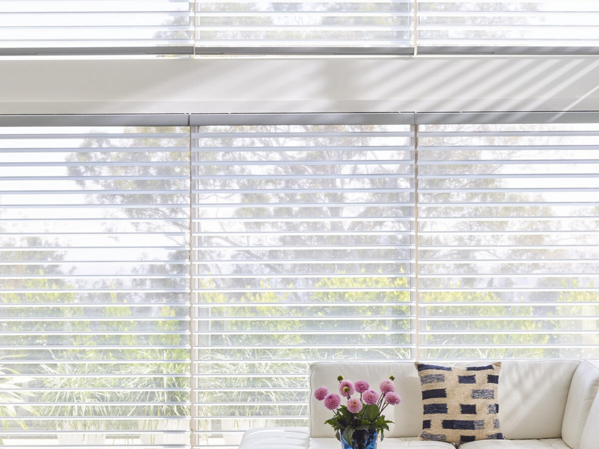 Silhouette® Window Shadings — soft fabric vanes suspended between sheer panels. Hunter Douglas.